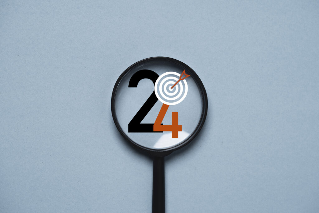 Loupe focalisée sur les chiffres 2024 avec une cible et une flèche