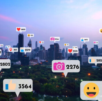 Vue d'une ville avec des icônes de réseaux sociaux affichant des interactions, symbolisant comment réussir sur les réseaux sociaux en 2024